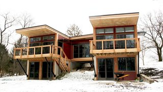 10 Prefabs Found on the East Coast - Photo 5 of 10 - Located on a picturesque country lane in Pittsburgh, the modules of this 1,240-square-foot prefab from Method Homes are connected by a suspended glass-filled bridge.