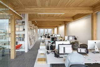 Albina Yard—Pioneering the Future of Sustainable Mass Timber Construction - Photo 2 of 8 - "For a creative office like this, we wanted more open space, so we combined a CLT floor with glue-laminated columns and beams. They work as a system," explains Robinson about LEVER Architecture's office space.
