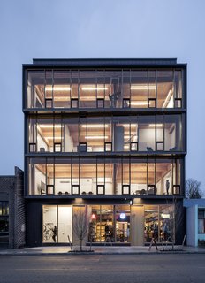 Albina Yard—Pioneering the Future of Sustainable Mass Timber Construction - Photo 8 of 8 - The exposed Douglas fir structural frame is aesthetically beautiful, especially when illuminated at night.