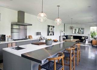 The house contains four bedrooms and two-and-a-half baths. The open kitchen is by Boffi. 