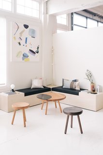 Artwork figures prominently in Spartan Shop's assortment. Hanging over a custom nook by De Jong & Co. is a painting by Portland artist Amy Bernstein. 