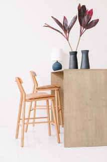  "We have a good assortment of local makers in the shop, but we also have artisans from all over that we have long-standing relationships with. So, if we have a customer that wants to custom-make a ceramic set, we have the relationship with the makers to do it," explained Person. Shown here are the barstools in oak from De Jong & Co. 