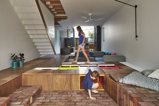 The Mill House in Melbourne, Australia, by Austin Maynard Architects incorporates a kind of giant toy box beneath the floor of the main living space. 