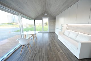 Using a 3D-printing robot to create the walls, roof, and floor, PassivDom's 380-square-foot model can be printed in about eight hours. The rest of the home, including the windows, doors, plumbing, and electrical systems, are then added by hand. 