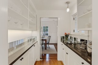 A butler's pantry leads from the kitchen area to the dining room. 