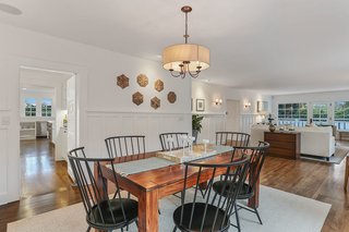 The dining room is adjacent to the living room and offers easy access to the kitchen and butler’s pantry—perfect for entertaining.