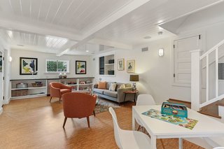 At the basement level, there is an additional family room with a half bath and access to the covered patio and gardens.