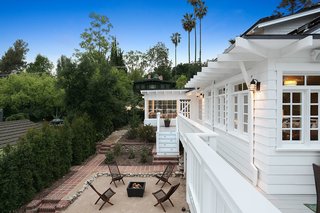 There are numerous outdoor areas perfect for enjoying Southern Californian indoor-outdoor living. These include the restored front porch, an expansive wrap-around deck (which is original and one of the first built in Pasadena), and a covered patio. Off the patio there is an additional finished room which could be used as a studio. 