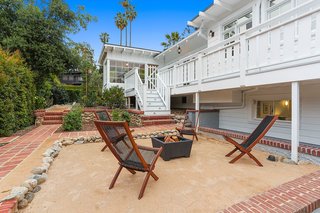 The landscaping of the garden includes orange and pomegranate trees, vegetable plots, and a new bocce ball court.