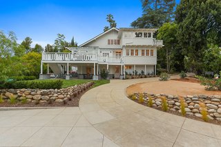 The original circular driveway has been restored and the garage relocated, allowing for expanded gardens and gathering spots as they were originally intended. 
