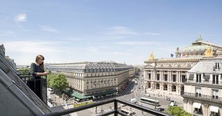 The balcony offers guests and staff incredible views of the Eiffel Tower and Opera Garnier.
