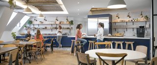 The "cuisine" is the heart and soul of the Paris office. It's a communal space for gathering that helps employees stay connected, building on local traditions where staff members eat together everyday. This creates a genuine sense of family and home in the workspace. During construction, the team discovered existing skylights and original wood beams, which they were able to expose and incorporate into the new design to offer a more open and airy kitchen space.