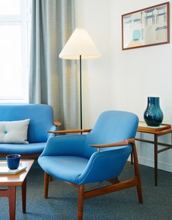 The Finn Juhl Deluxe Room boasts a Finn Juhl NV 53 Chair and NV 53 Sofa.