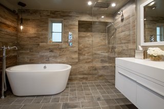 The guest quarters' renovations include updated bathrooms features such as a floating Gessi vanity. 