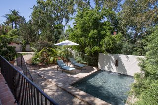 A separate structure houses a state-of-the-art gym and spa with a steam shower and a massage room. The bi-fold doors of the spa open to a tranquil reflection pool and sun deck. 