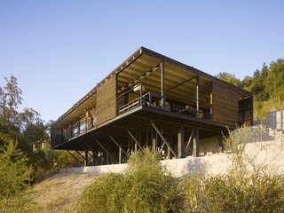 A vacation home commissioned by a good friend, Klotz designed Casa Raúl like he was designing a home for himself. Little did he know, the home would one day become his own. Close to Santiago in the Andean foothills overlooking Lake Aculeo, the uneven topography of the site presented a special challenge for the architect. The home also needed to be accessible for the client's disabled son, with wide circulation areas on a single level. Unfortunately, a few years after completion, the client was forced to sell the home, but asked Klotz to help him with the process. Klotz asked for the keys to take a few photos, and upon seeing the stunning lake view from the terrace, called his friend to tell him that he had found his buyer. Casa Raúl is now Klotz's family weekend refuge. 