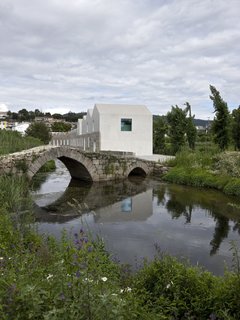 A New Book Examines the Art of Breathing Life Into Forgotten Architecture - Photo 4 of 16 - In Guimaraes, Portugal, Cannatà e Fernandes took sections of this 19th-century stone factory—which were beyond repair—and replaced them with white concrete. 