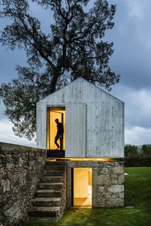 A New Book Examines the Art of Breathing Life Into Forgotten Architecture - Photo 5 of 16 - In Soutelo, Portugal, AZO Sequeira Arquitectos Associados transformed this 1920s derelict stone-and-wood backyard dovecote into a magical and minimalist concrete children's playhouse. It's complete with a separate level for showers to complement their client's backyard swimming pool. 