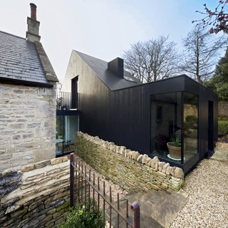 A New Book Examines the Art of Breathing Life Into Forgotten Architecture - Photo 6 of 16 - To enhance this renovation for a stone-and-slate Baptist church from 1867 in Wiltshire, UK, Jonathan Tuckey Design used blackened timber as a direct reference to the tin tabernacle churches, which is a vernacular type that exists in the rural West Country part of England, to the southwest of London. 