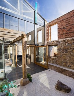 A New Book Examines the Art of Breathing Life Into Forgotten Architecture - Photo 8 of 16 - With the use of glass, the outer space of this building became part of the interior space in a renovation by Jesús Castillo Oli in Palencia, Spain. Located in a rural area of northern Spain, the industrial structure was in a state of ruin prior to being transformed into a vacation home. 