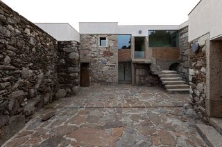 A New Book Examines the Art of Breathing Life Into Forgotten Architecture - Photo 10 of 16 - To fill in existing irregularities and to create a new clean roofline for this home in Caminha, Portugal, Brandão Costa Arquitectos placed concrete on top of the original stone mass. 