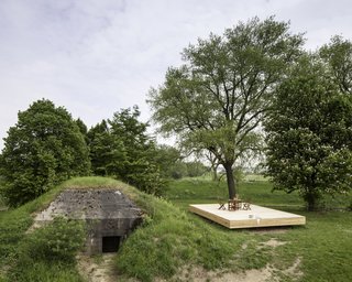 A New Book Examines the Art of Breathing Life Into Forgotten Architecture - Photo 13 of 16 - Taking inspiration from Le Cabanon by Le Corbusier, the architectural firm B-ILD created modular wooden fittings that would maximize the potential of the interior space of this bunker-turned-holiday home in Vuren, the Netherlands.