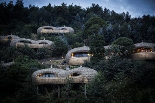 The spherical, thatched structures echo the thousands of hills that dot the Rwandan countryside.