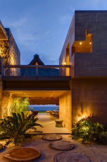 The home features a stunning view of a private beach.