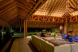 The living/dining area is in a palapa made of natural parota wood, which is over 33 feet high.