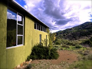 Set on 40 Enchanting Acres in Ojai, This Award-Winning Green Residence Is on the Market For $2.2M - Photo 2 of 10 - The stunning contemporary home is framed by a tapestry of rolling hills.