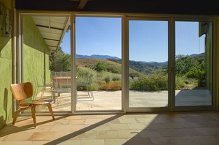 Set on 40 Enchanting Acres in Ojai, This Award-Winning Green Residence Is on the Market For $2.2M - Photo 3 of 10 - The patio looks out on Ojai’s famous Topatopa Mountain Range.