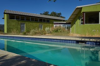 Set on 40 Enchanting Acres in Ojai, This Award-Winning Green Residence Is on the Market For $2.2M - Photo 7 of 10 - The pool defines the exterior courtyard space and overlooks the surrounding hills.