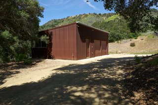 Set on 40 Enchanting Acres in Ojai, This Award-Winning Green Residence Is on the Market For $2.2M - Photo 8 of 10 - A Corten-clad 630-square-foot separate structure houses a two-car garage and an art studio.