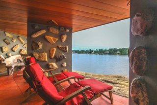 The home is anchored by stone pillars that support thick horizontal planes.