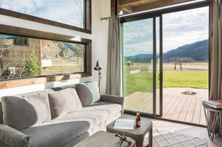 Sliding doors open to a deck offering incredible views of the local landscape. 