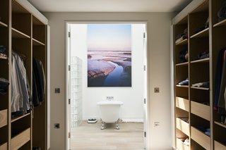  The master bedroom suite also includes a spacious dressing room that leads to the en suite bath.