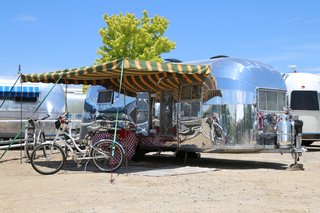 Live the Airstream Life Vicariously With a New Book That Celebrates the Timeless Trailers - Photo 11 of 19 - The renovation of this 1955 Flying Cloud features a whale tail (or the Dutchman’s cap) and is the creation of Paul and Mary Drag. 