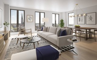 French door-inspired windows open up the space, letting natural light flood into the interiors. 