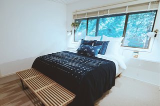 The Shibori room features bedding made with the Japanese shibori dyeing technique, including pillowcases handmade by Vivian. 