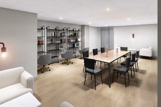 These Condos Would Be a Dream For Anyone Who Works Remotely - Photo 11 of 11 - Individual workstations and a conference table are included in the in-house co-working space.