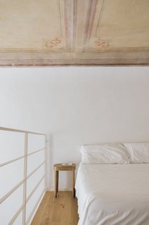 A 16th-Century Florentine Palazzo Is Transformed Into an Artist Residency - Photo 2 of 19 - In Florence, walls have traditionally been painted yellow, but the design team decided to paint the renovated space white in order to brighten it up, while leaving the original ceiling frescos intact. 