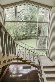A grand staircase leads to the second level the home also features an elevator.