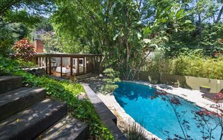 The lagoon-like pool sparkles in the L.A. sun. 