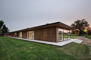 The exterior features Siberian larch cladding.