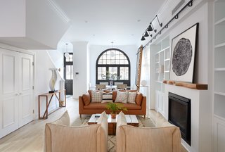 Two Renovated Carriage Houses in Brooklyn Hit the Market - Photo 8 of 13 - Built-in shelving and a gas fireplace with a customized mantel by Fitzhugh Karol preside over 411 Vanderbilt's living room. 