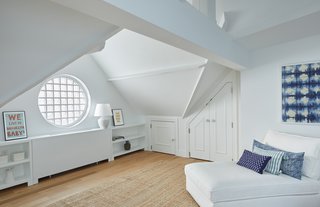Two Renovated Carriage Houses in Brooklyn Hit the Market - Photo 12 of 13 - The third floor of 411 Vanderbilt features a fourth private bedroom with peaked ceilings, exposed beams, an ensuite bath and a round window.