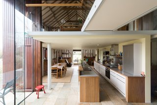 The full-height glazing amplifies the interior's airy, industrial vibe. 
