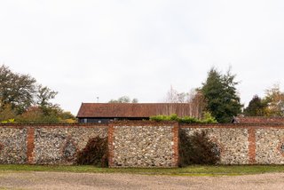 An exterior stone wall surrounds the property.