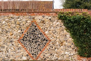 The exterior stone wall