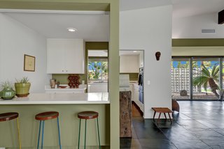 The kitchen features bar seating. 